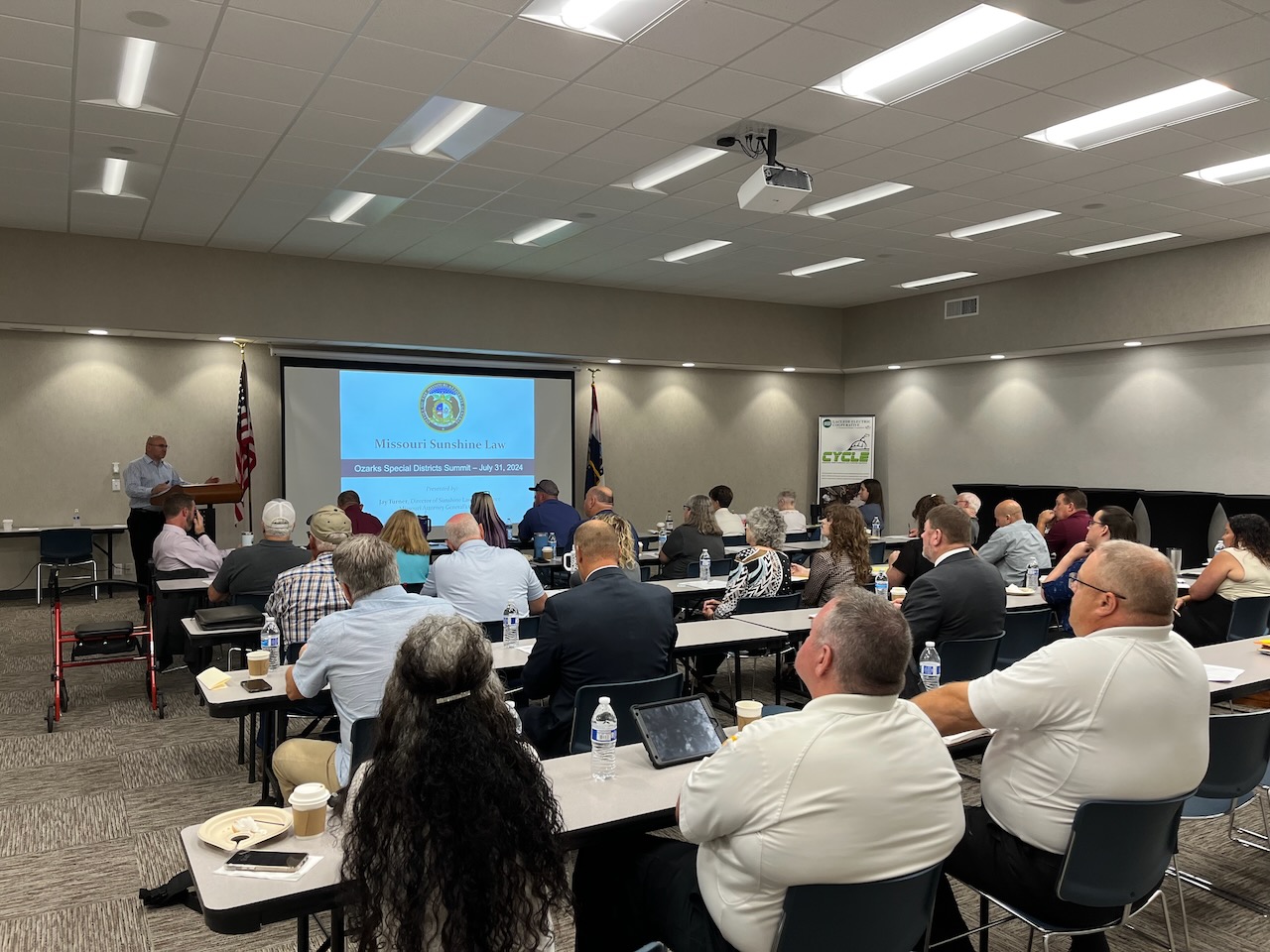 Special district leaders meet in a room for a presentation.